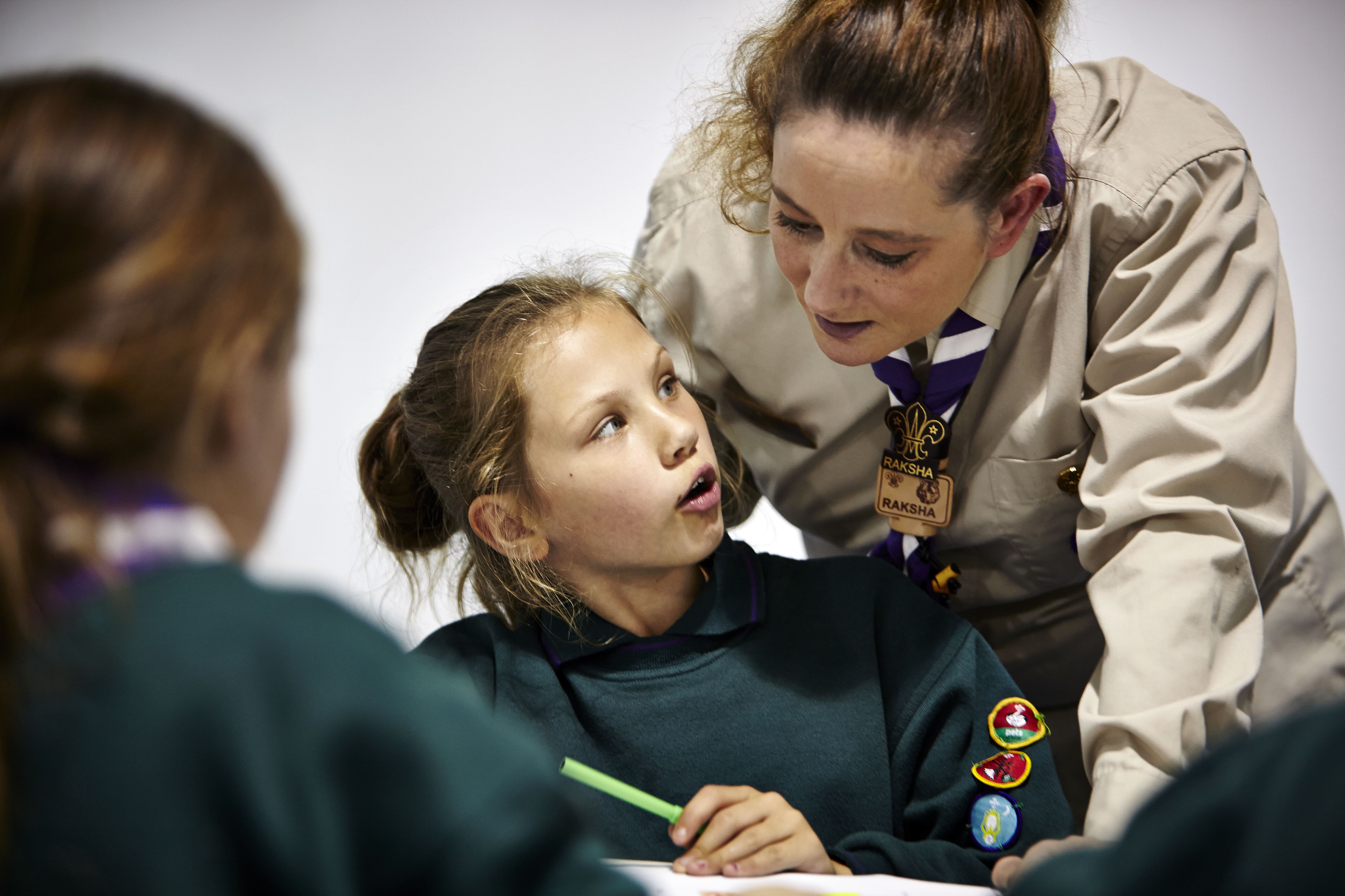 Beavers doing an activity while being helped by young leaders (Stock Scout Image)
