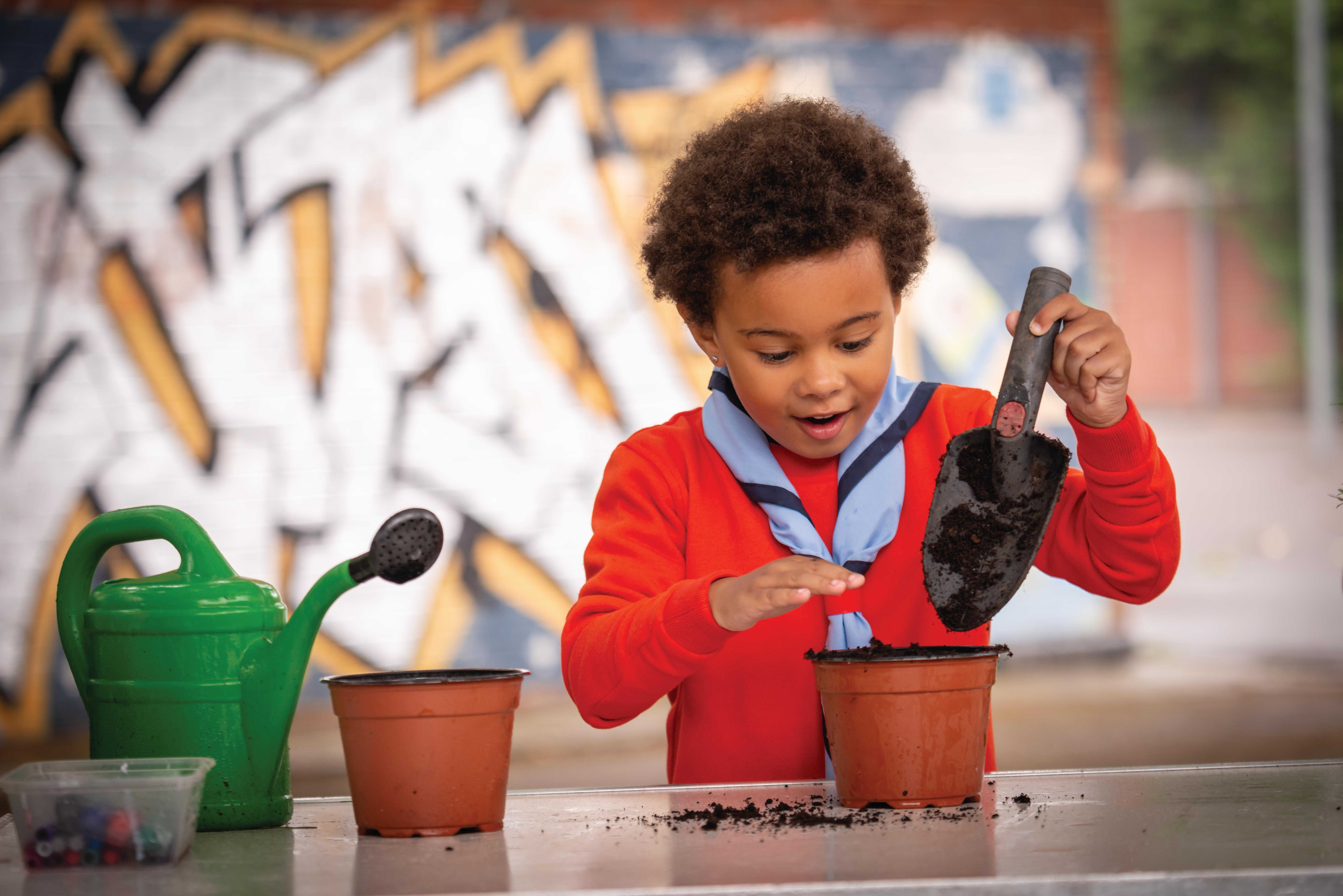 Beavers doing an activity while being helped by young leaders (Stock Scout Image)